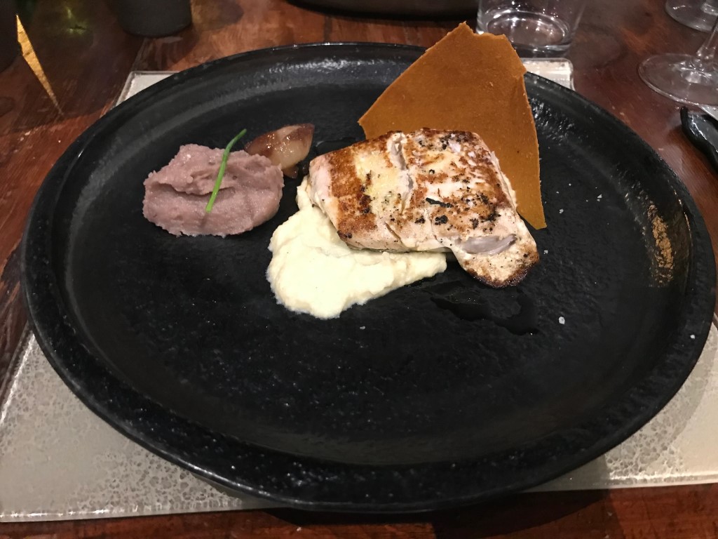 Grilled fish fillet with pureed potato, red bean cream, and crispy wafer at Osteria I'Ciocio, Suvereto