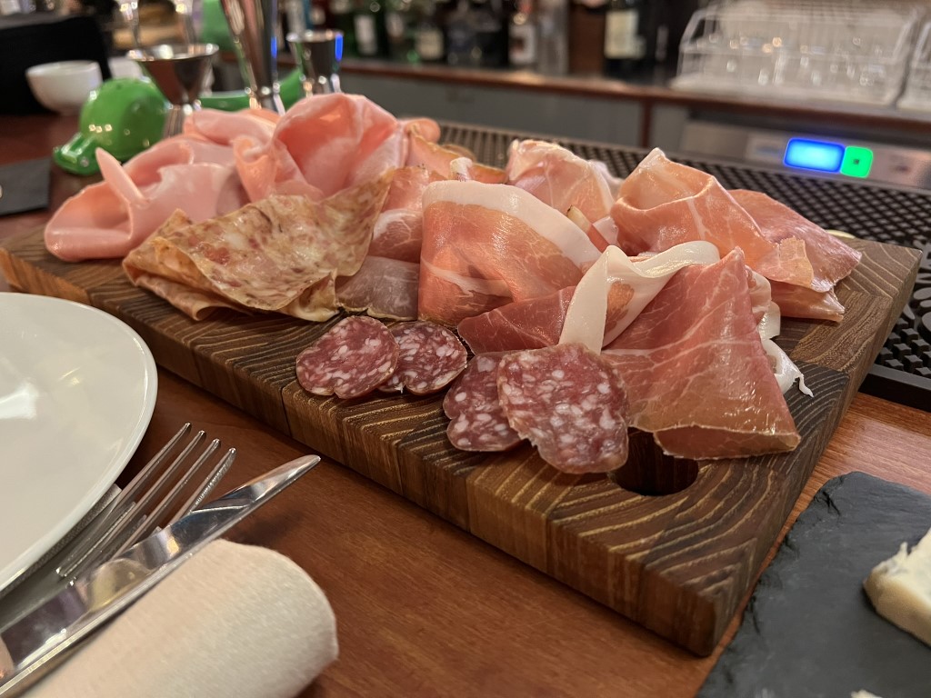 Italian charcuterie board at Parlor Bologna, with prosciutto, mortadella, and salami slices