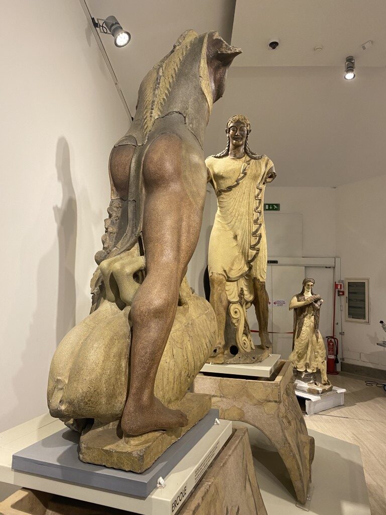 Hercules (Ercole) terracotta sculpture with Etruscan deity figures at Villa Giulia Museum, Rome