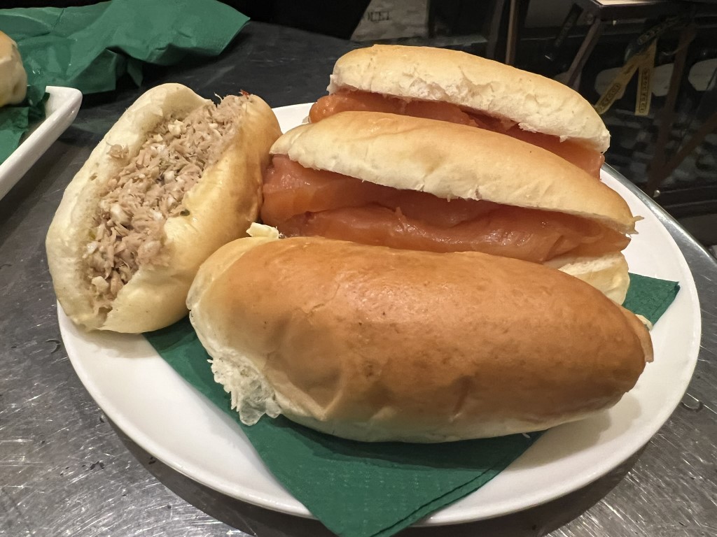 Plate of Procacci 1885 finger rolls filled with smoked salmon and tuna in Florence