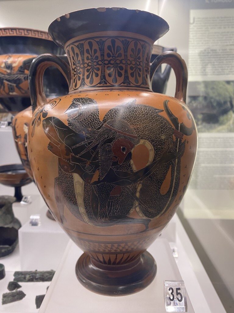 Black-figure amphora displayed at Villa Giulia Etruscan Museum, showing a warrior battle scene, item 35
