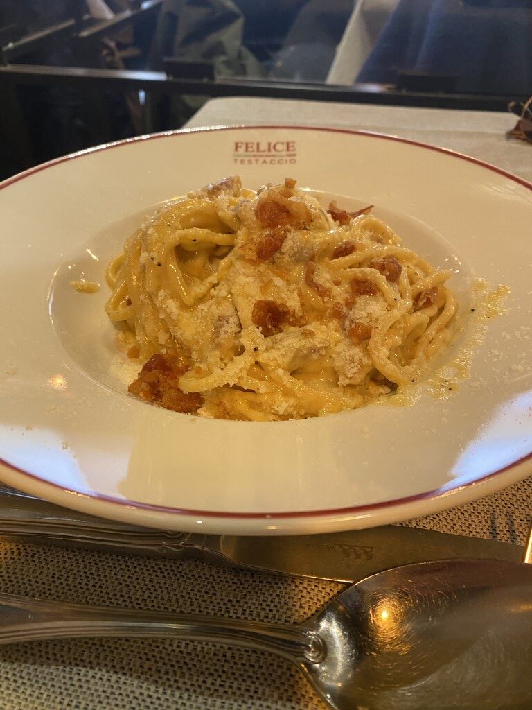 Tonnarelli cacio e pepe served at Felice a Testaccio, Rome, topped with pecorino and guanciale