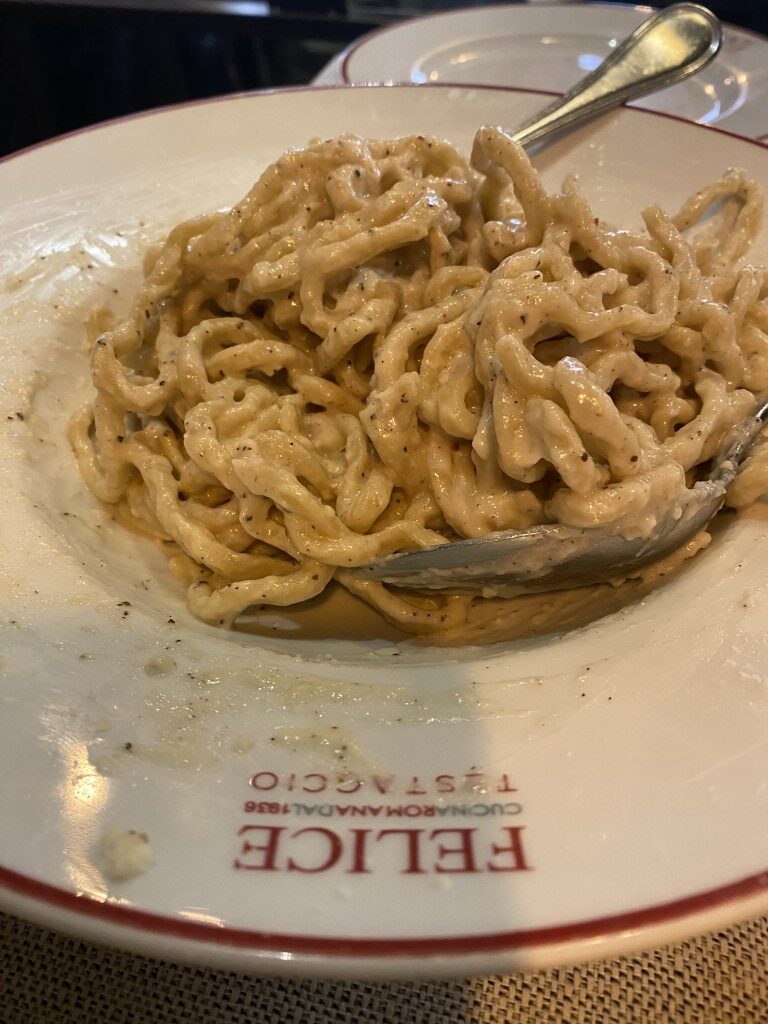Cacio e pepe pasta served at Felice a Testaccio, Rome, coated in creamy pecorino sauce