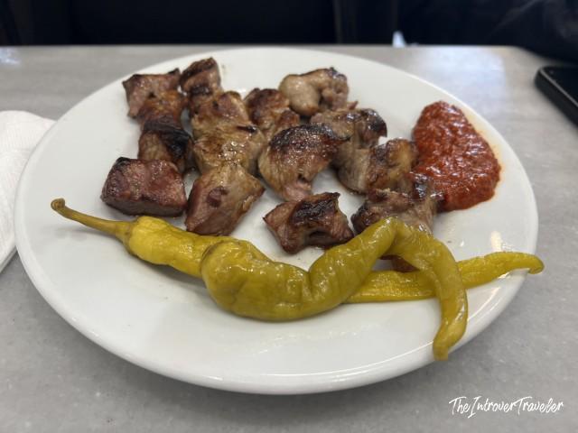 Grilled meat cubes with roasted peppers and tomato sauce, a classic Istanbul tavern dish
