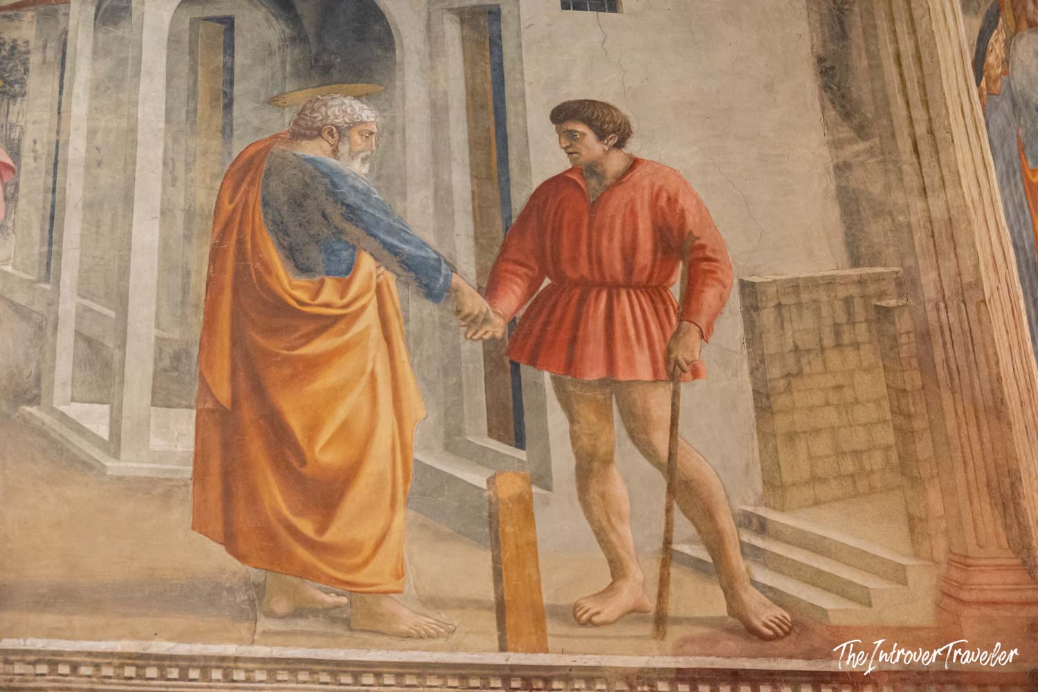 Masaccio fresco detail in the Brancacci Chapel, showing Saint Peter and a figure in red robes