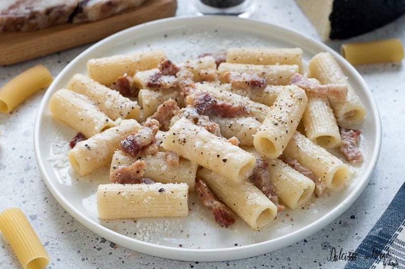 Plate of pasta alla gricia with guanciale, pecorino, and black pepper, a classic Roman pasta dish