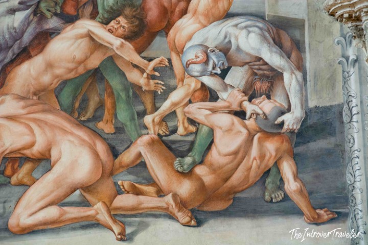 Detail of Luca Signorelli's Hell fresco in Orvieto Cathedral, showing demons tormenting the damned