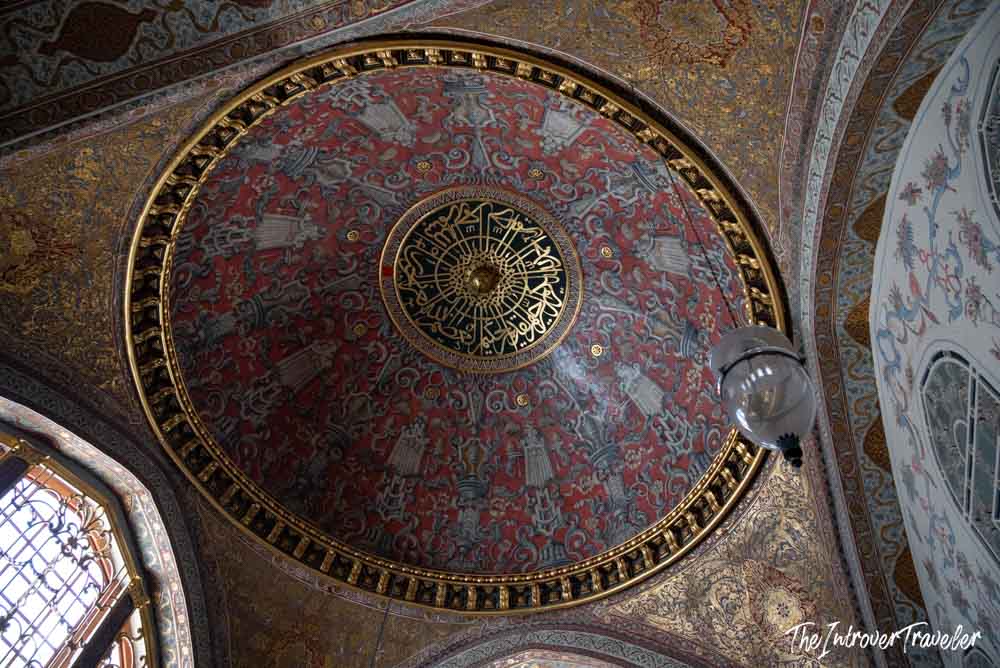 Ornate gilded dome interior with Arabic calligraphy at Topkapi Palace, Istanbul