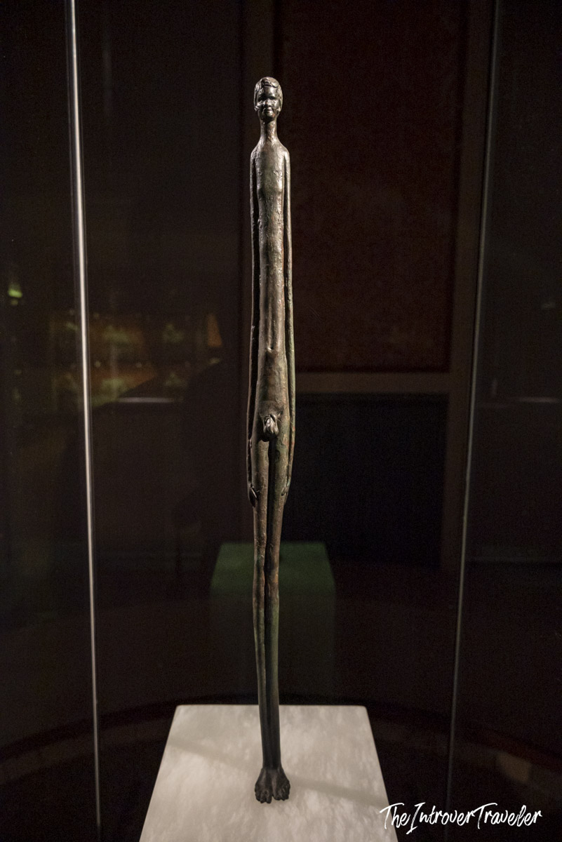 Elongated Etruscan bronze figurine "L'Ombra della Sera" displayed at the Museo Etrusco Guarnacci, Volterra