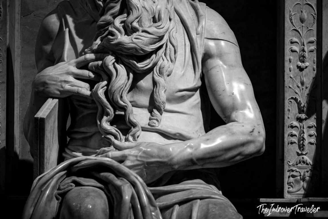 Close-up of Michelangelo's Moses torso and beard, showing powerful marble musculature at San Pietro in Vincoli, Rome