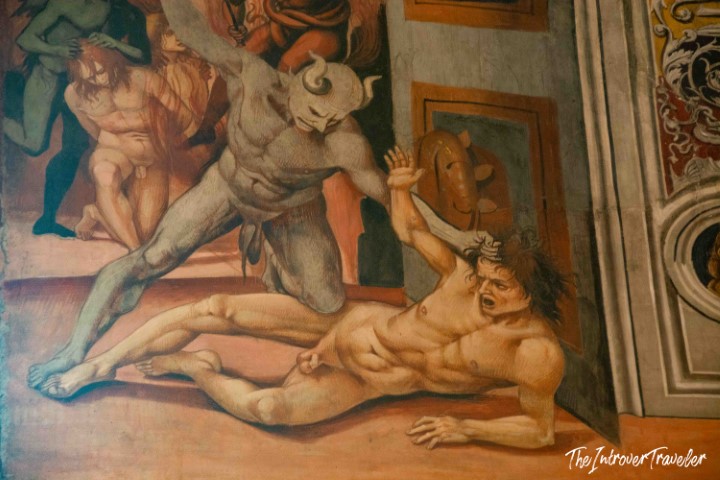 Luca Signorelli fresco detail, Orvieto Cathedral: a horned demon drags a damned soul in the Last Judgment cycle