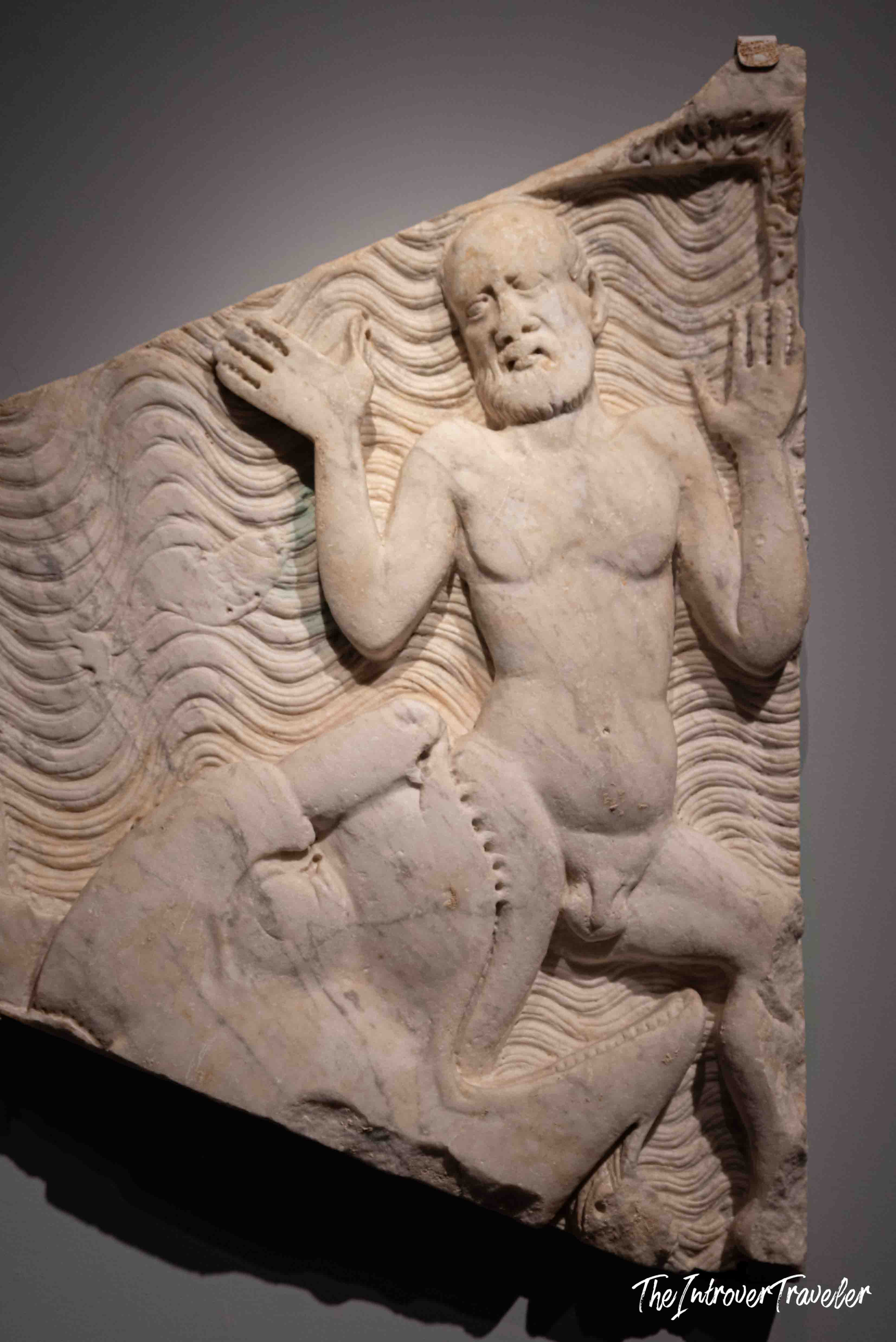 Ancient Roman marble relief of Jonah cast from a whale's mouth, evoking sea creature myths of the Mediterranean