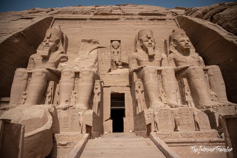 Four colossal Ramesses II statues flanking the entrance to Abu Simbel Great Temple, Egypt