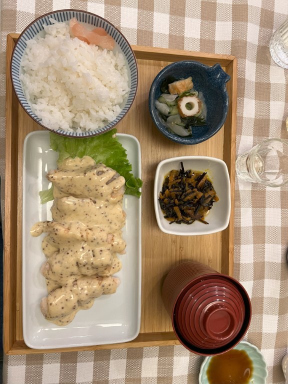 Japanese set meal at Yuzuya Bologna, with creamy chicken, rice, hijiki, and oden sides