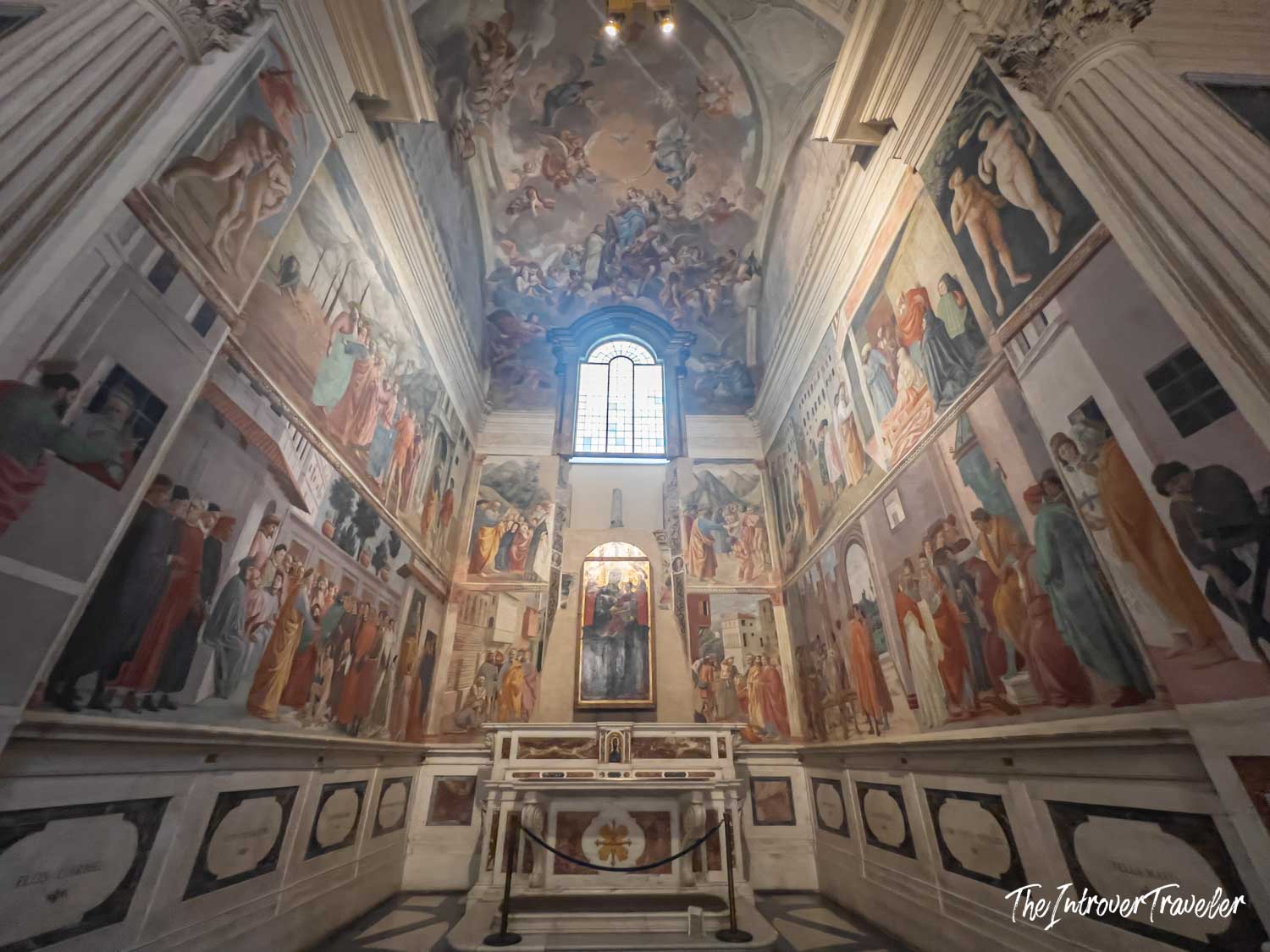 Brancacci Chapel interior in Florence, walls covered in Masaccio frescoes depicting scenes from the life of Saint Peter