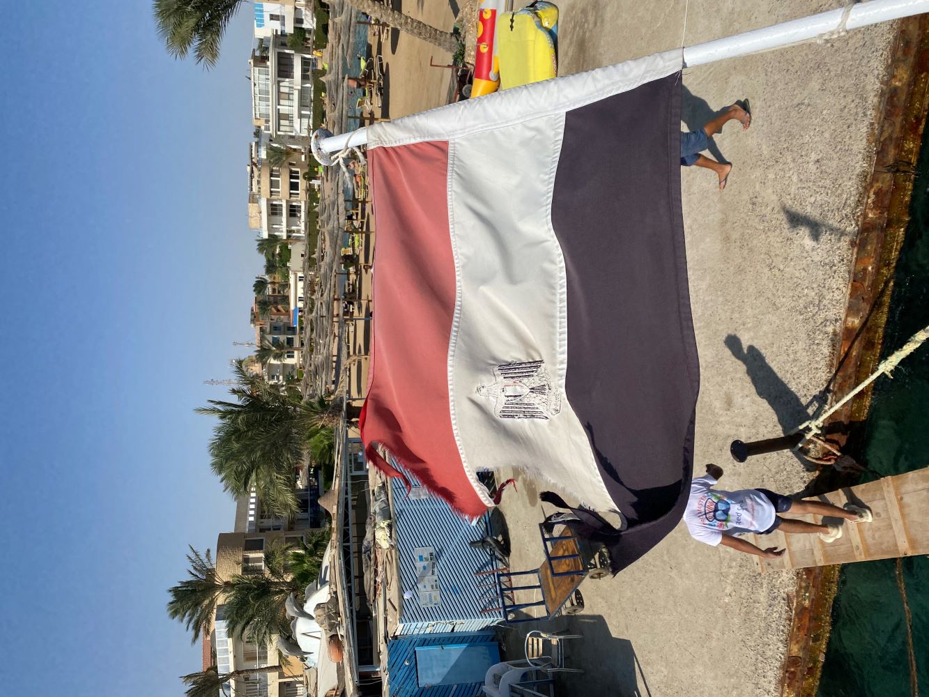Egyptian flag flying from a Red Sea diving liveaboard deck in Hurghada, Egypt
