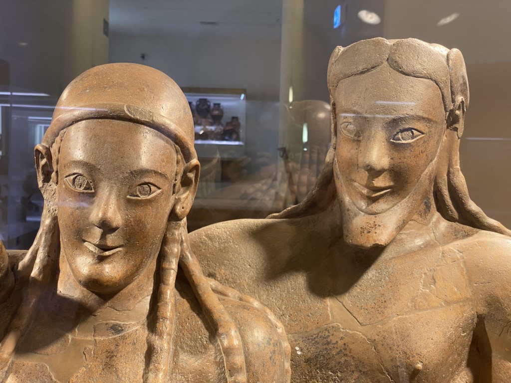Close-up of two Etruscan terracotta figures at the National Etruscan Museum of Villa Giulia, Rome