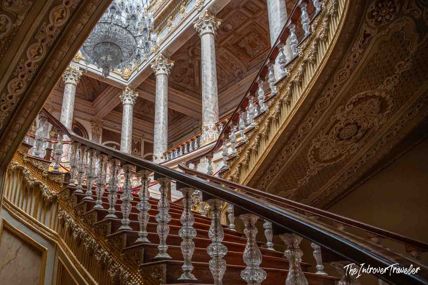 Grand staircase with crystal banisters and marble columns inside Dolmabahce Palace, Istanbul