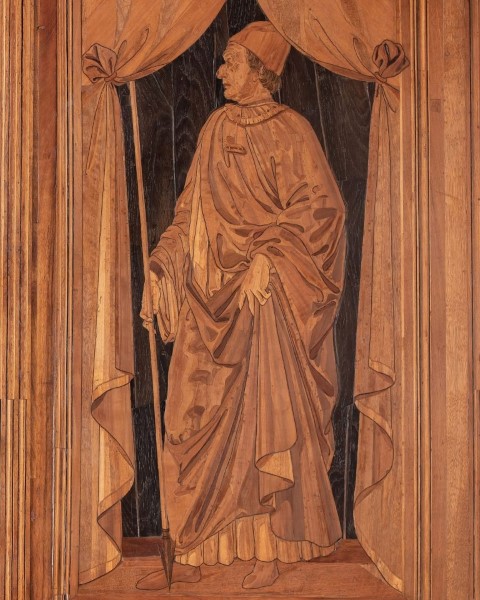 Intarsia wood panel depicting a robed figure in the Studiolo of Federico da Montefeltro, Urbino