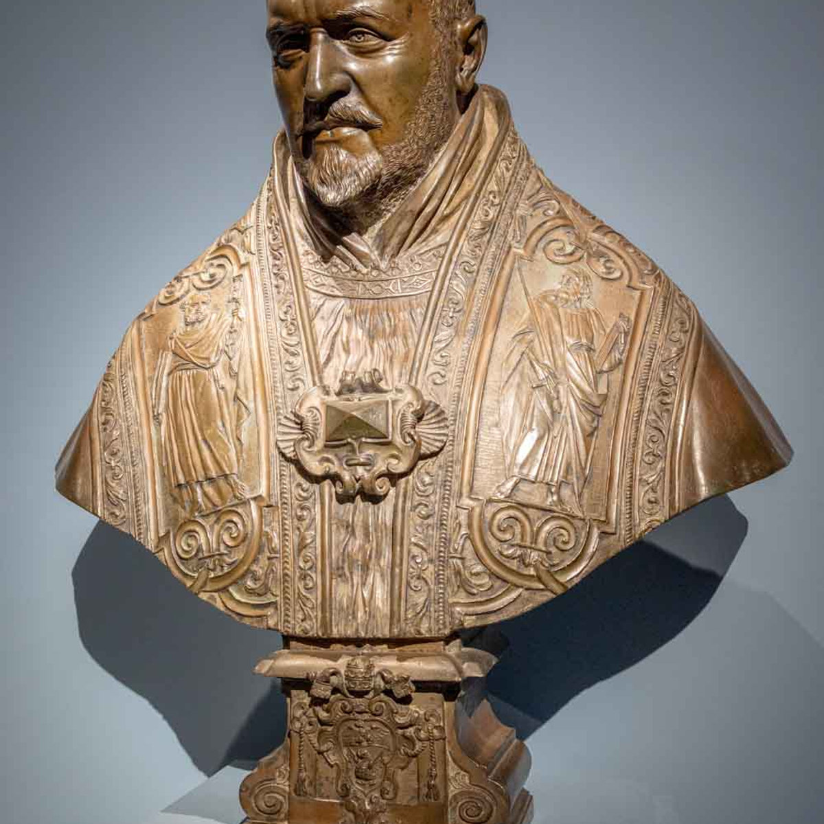 Bronze papal bust with ornate vestments and coat of arms, on display at the Bernini Barberini exhibition in Rome.