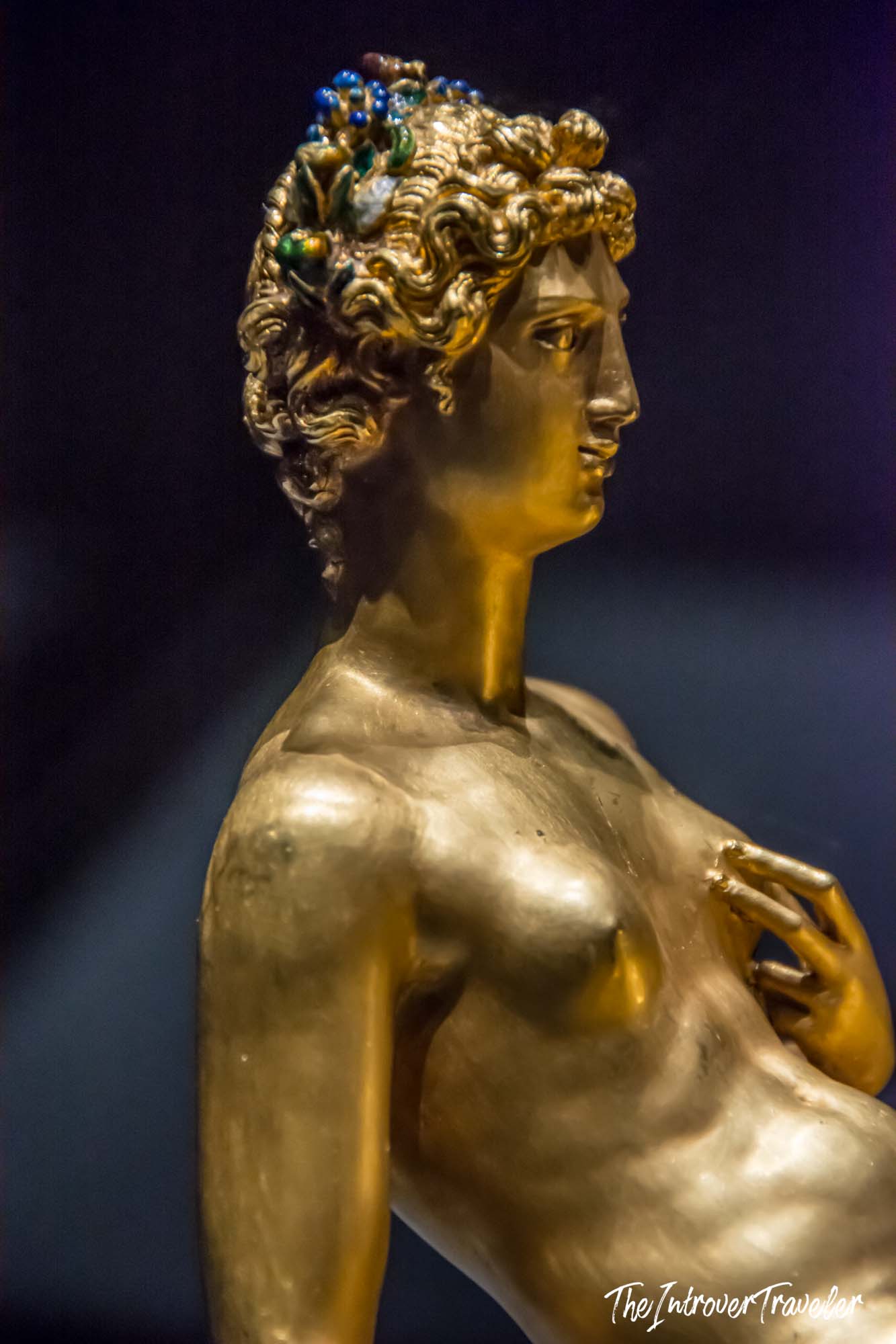 Golden figure of Neptune on Cellini's Salt Cellar, showing Mannerist elegance and jeweled details