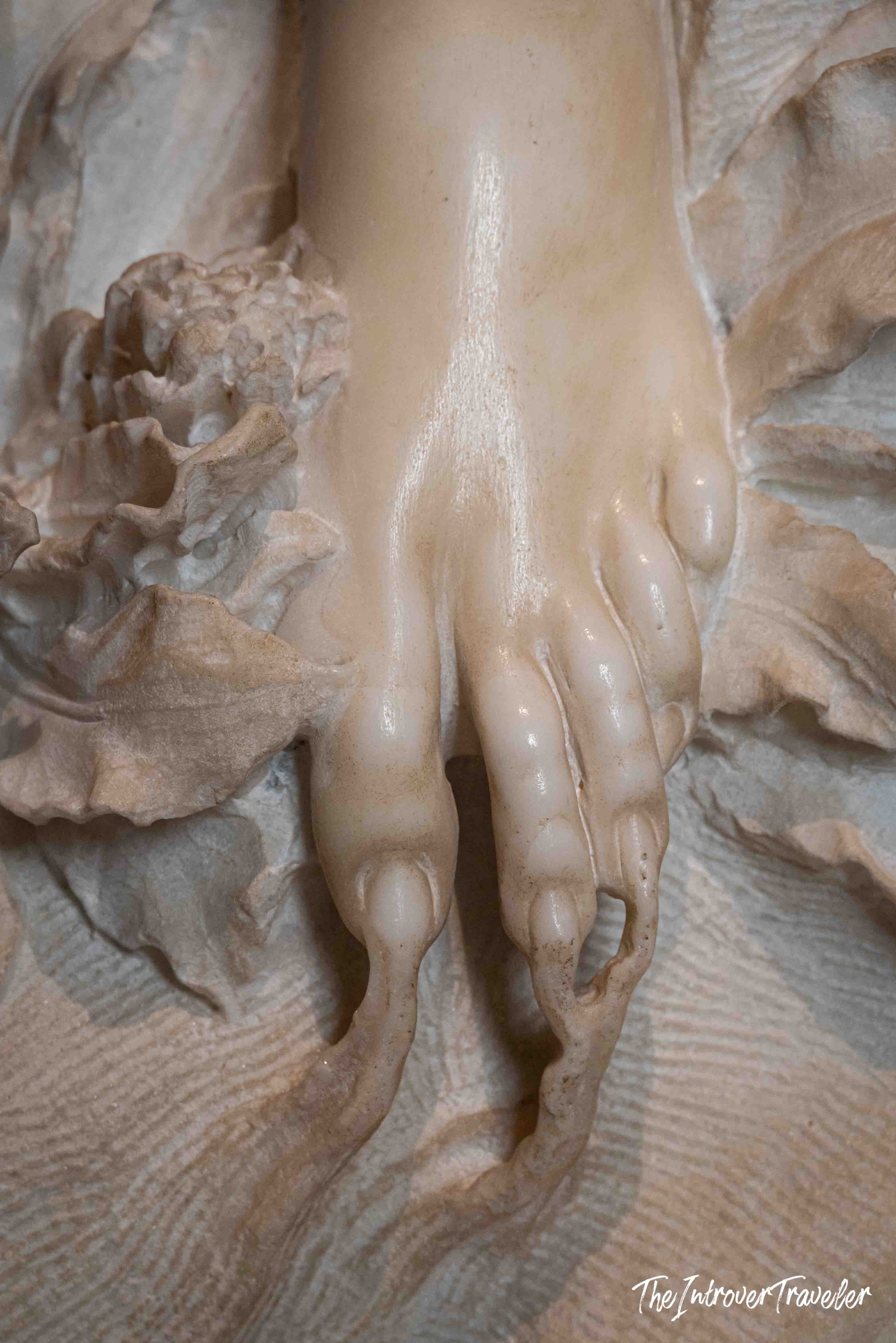 Close-up of Daphne's foot transforming into roots in Bernini's Apollo and Daphne, Borghese Gallery