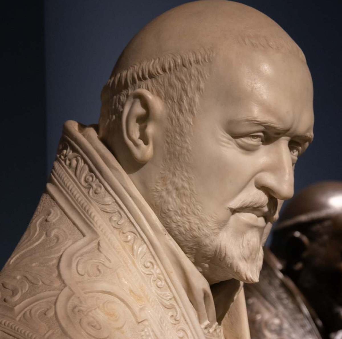 Marble papal bust by Bernini, detail showing ornate vestments, at Palazzo Barberini Baroque exhibition