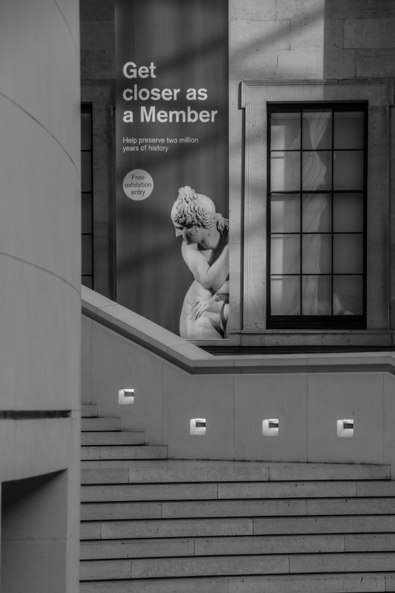 British Museum membership banner on the grand staircase, inviting visitors to get closer to history