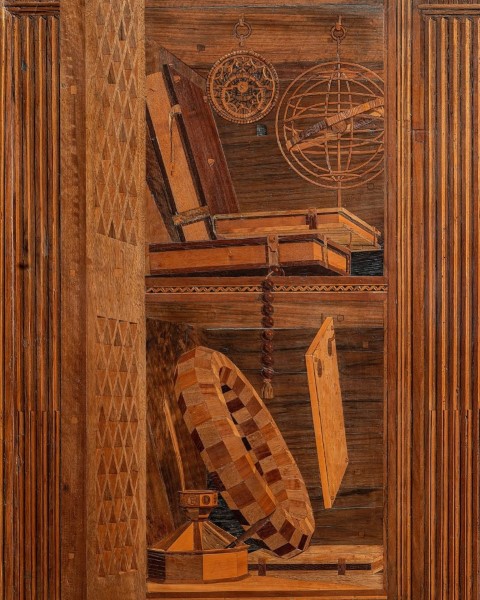 Intarsia panel in the Studiolo of Federico da Montefeltro, Urbino, depicting scientific instruments on shelves