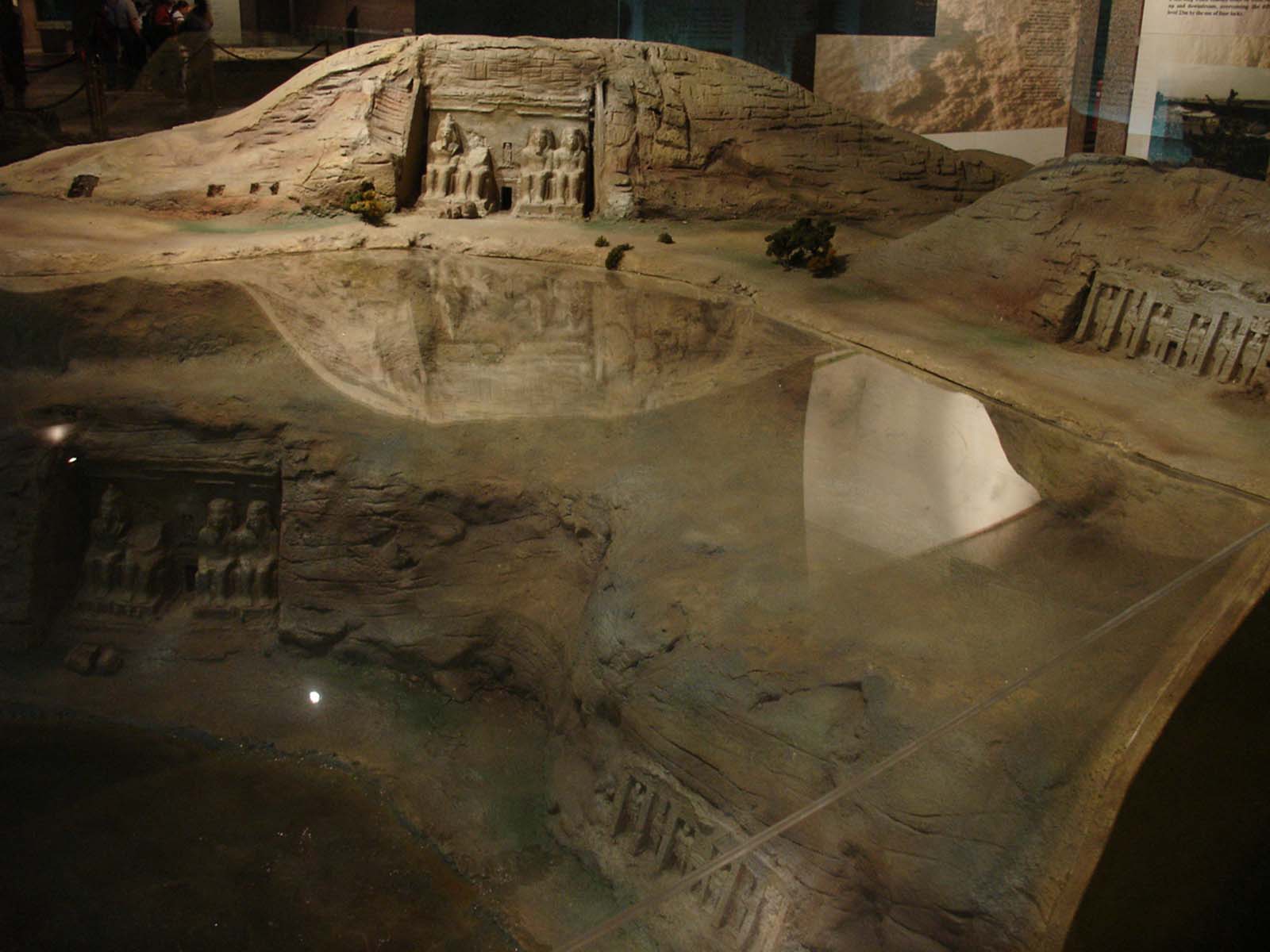 Museum scale model of Abu Simbel temples showing the original Nile riverbank location before relocation