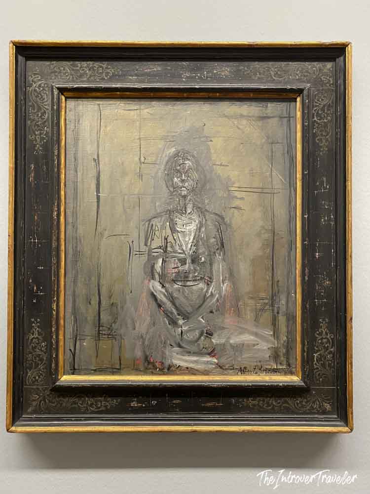 Giacometti seated figure painting on display at the Albertina Museum in Vienna