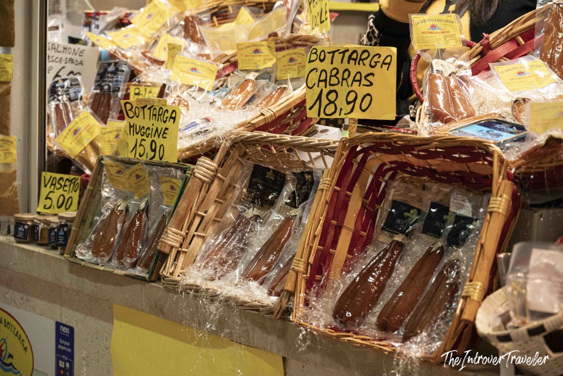Bottarga di Cabras and Bottarga Muggine for sale at a Sardinian fish market stall