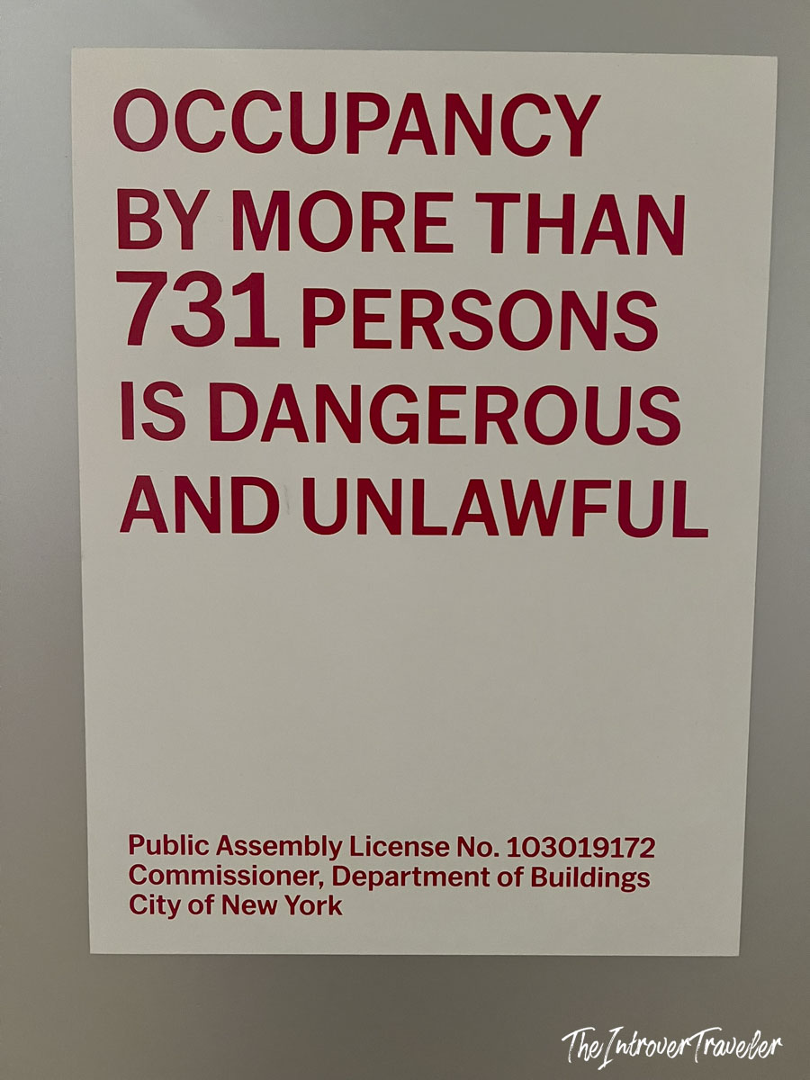 NYC Department of Buildings occupancy limit sign at MoMA, capping assembly at 731 persons