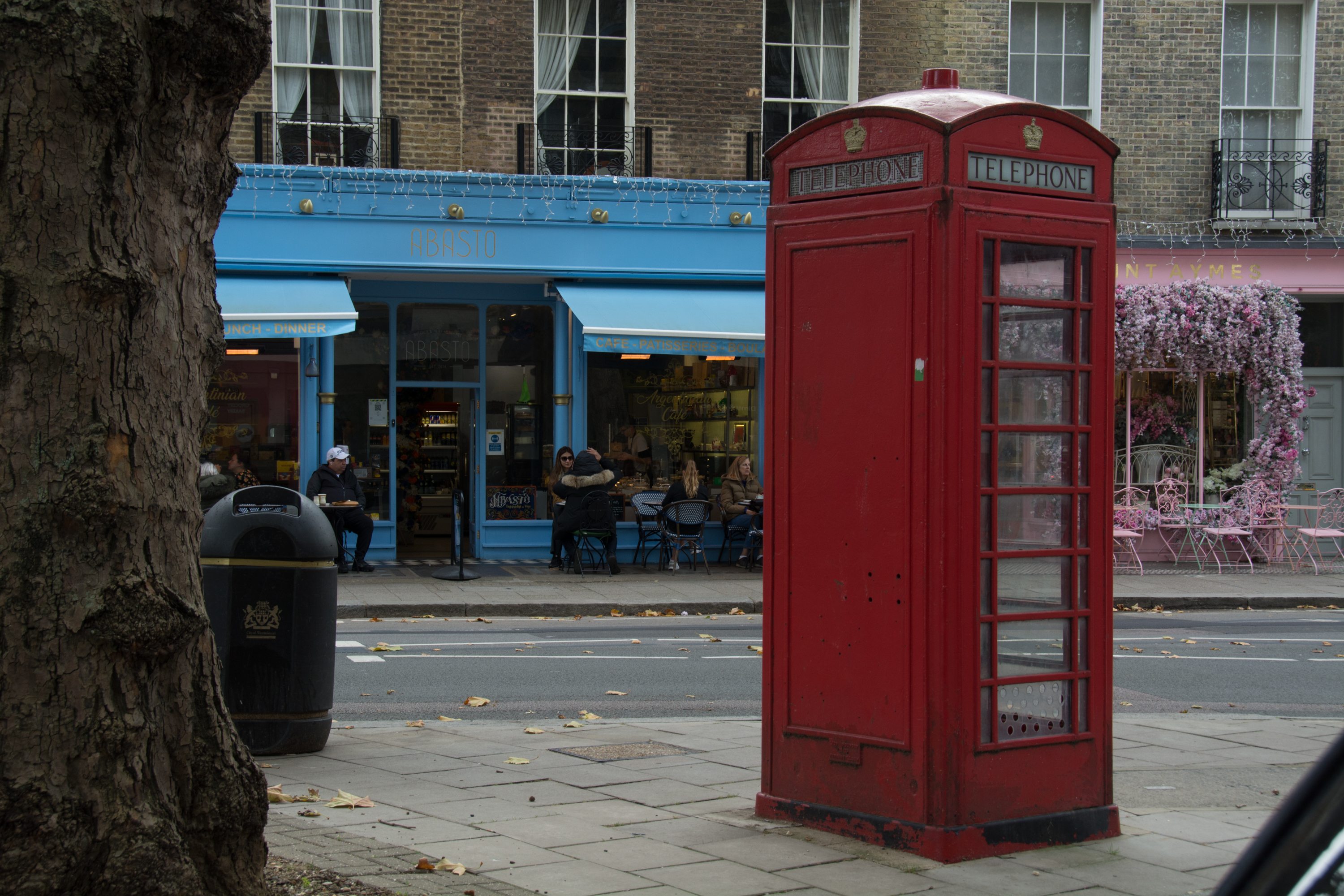 Red K6 telephone box on Connaught Street, a classic London landmark in an upscale neighborhood
