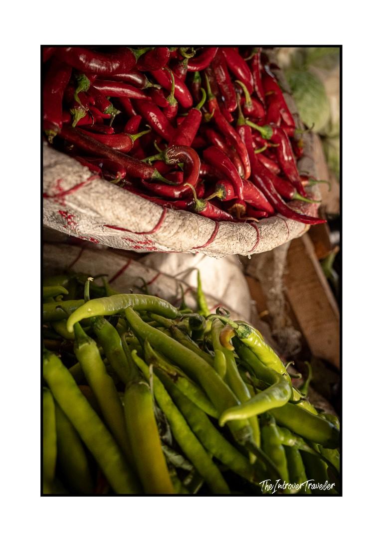 Red and green chili peppers piled at a street market stall, Cairo, Egypt