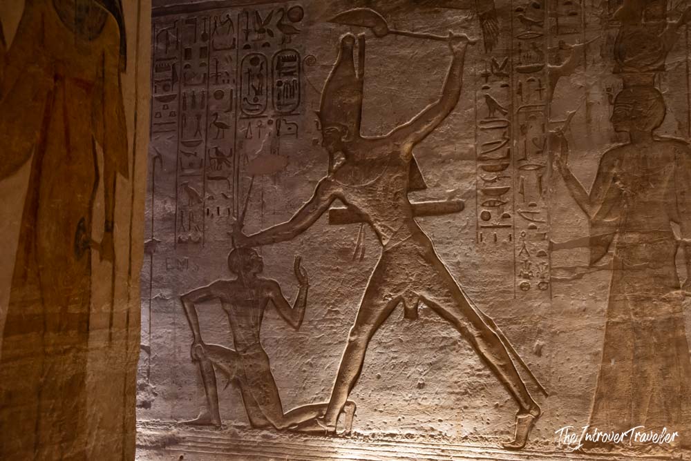 Ramesses II smiting enemies, carved relief with hieroglyphs inside Abu Simbel temple, Egypt