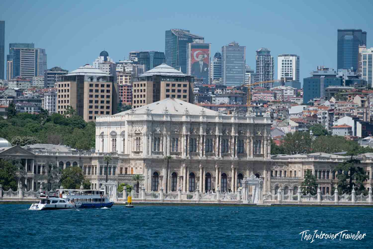 Dolmabahçe Palace viewed from the Bosphorus, with Istanbul's modern skyline behind