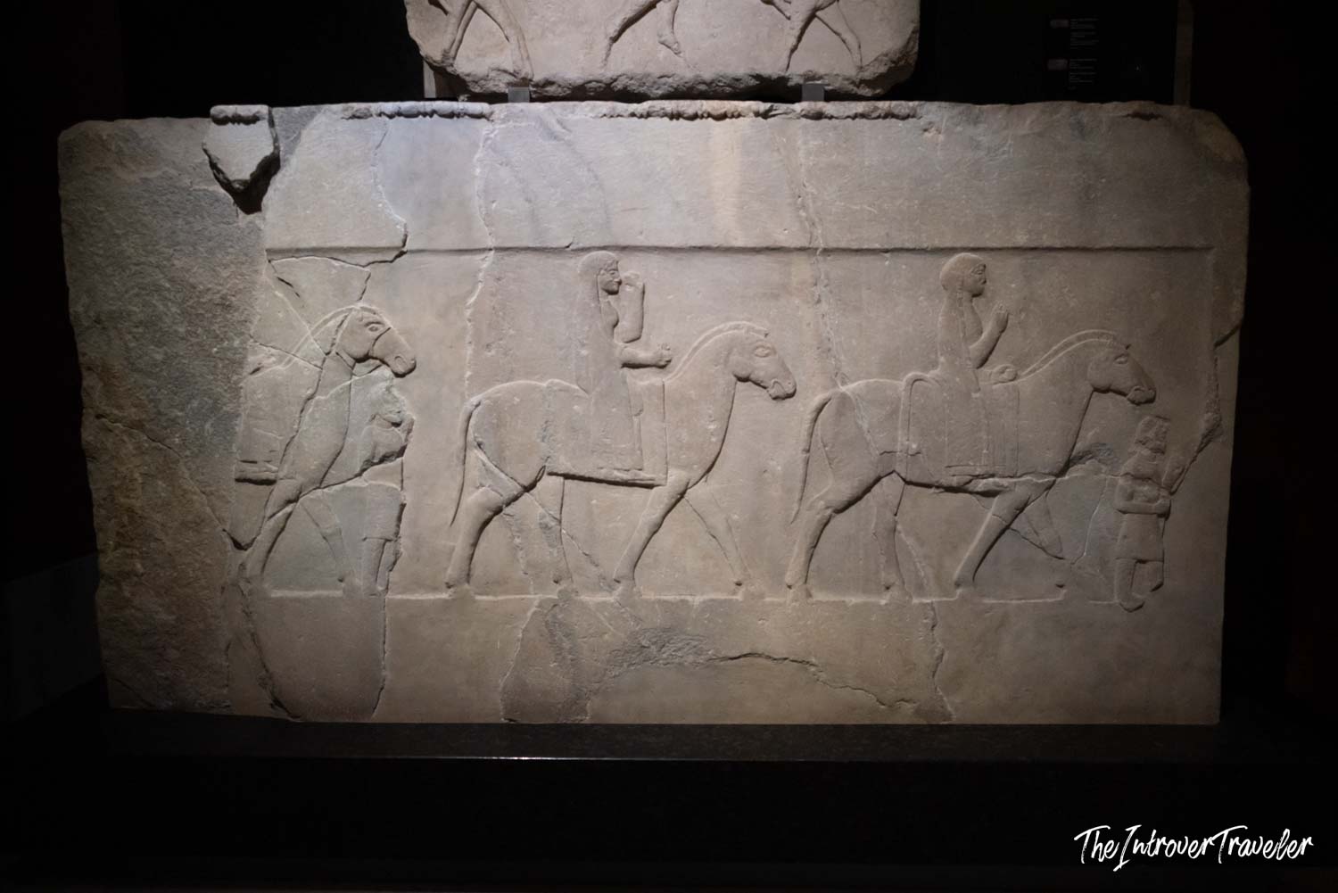 Ancient Greek marble relief showing horsemen and attendants, displayed at the Istanbul Archaeological Museum