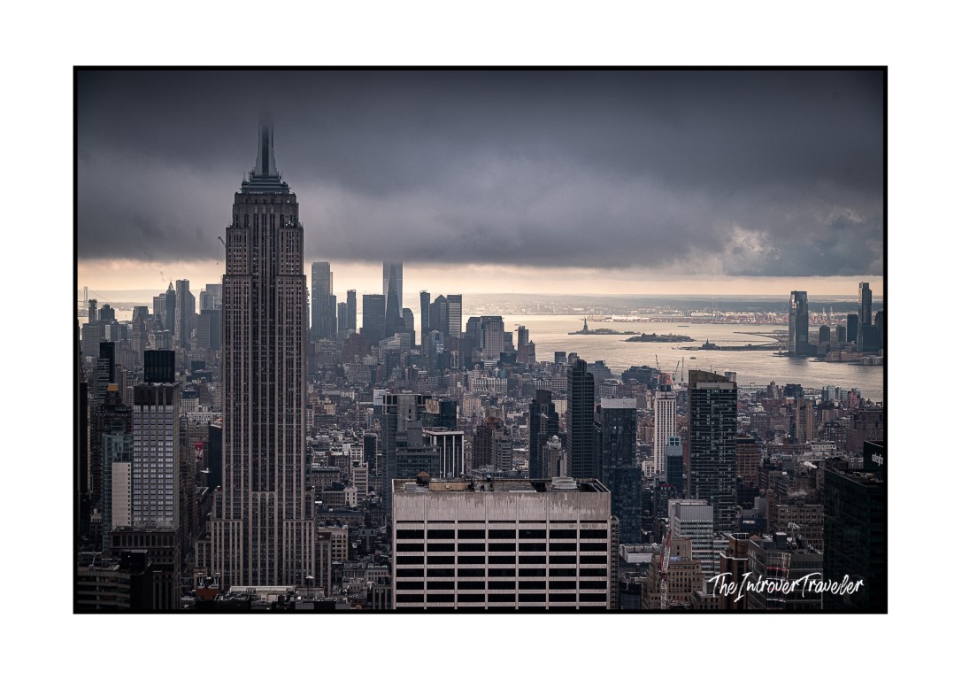 Empire State Building and Manhattan skyline viewed from Top of the Rock, under stormy skies