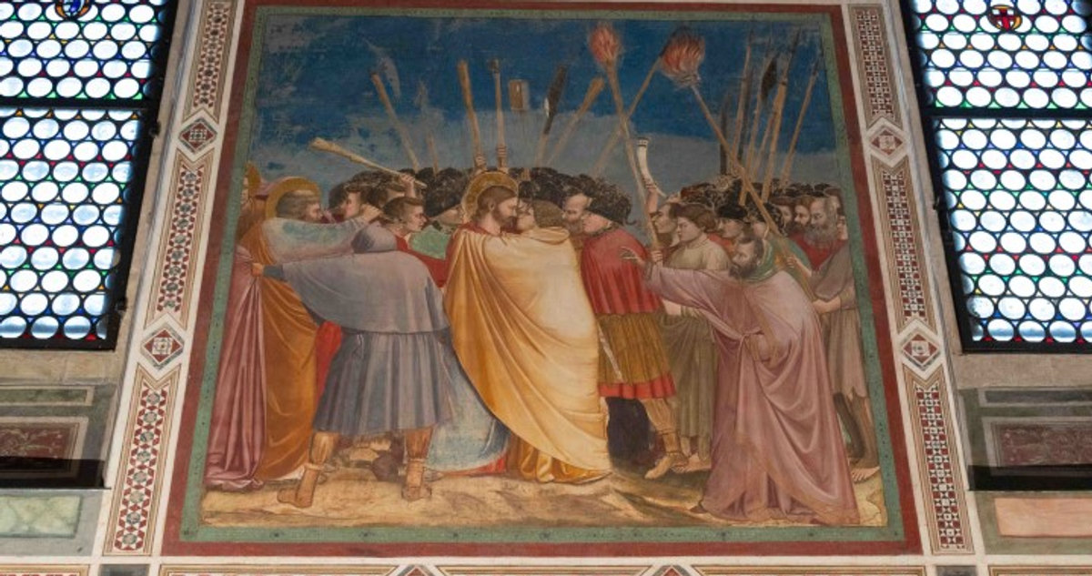 The Kiss of Judas fresco by Giotto in the Scrovegni Chapel, Padua, showing Christ and Judas surrounded by a crowd