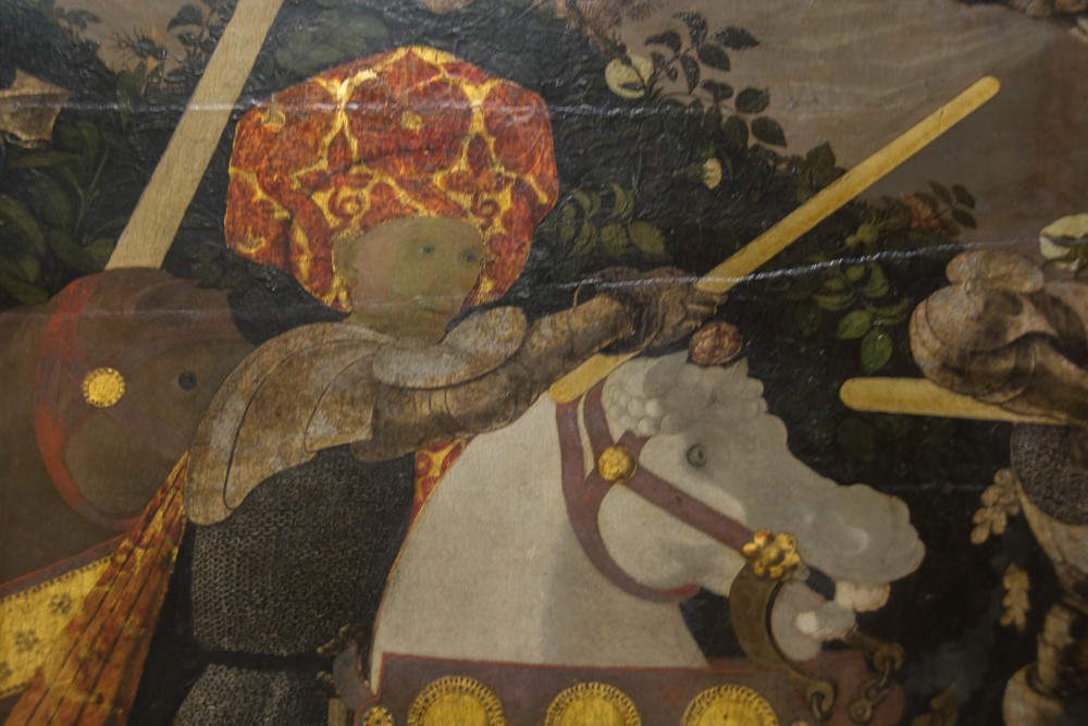 Detail of a medieval knight on horseback with lance, painting in the National Gallery London