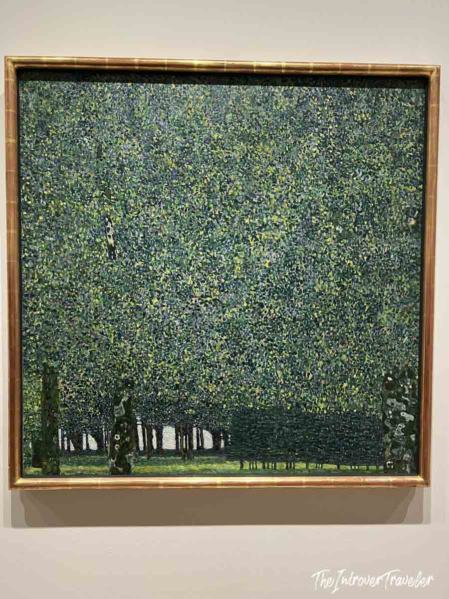 The Park by Gustav Klimt, a lush pointillist forest landscape on display at MoMA New York