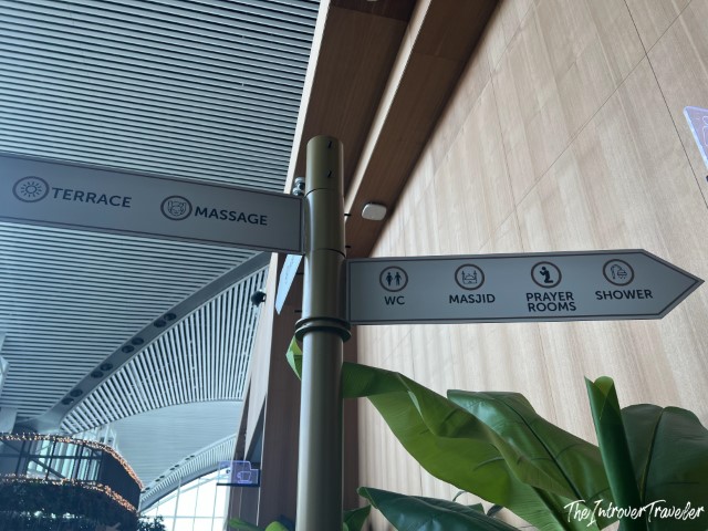 Directional signpost at IGA Lounge Istanbul Airport showing terrace, massage, masjid, prayer rooms, and showers