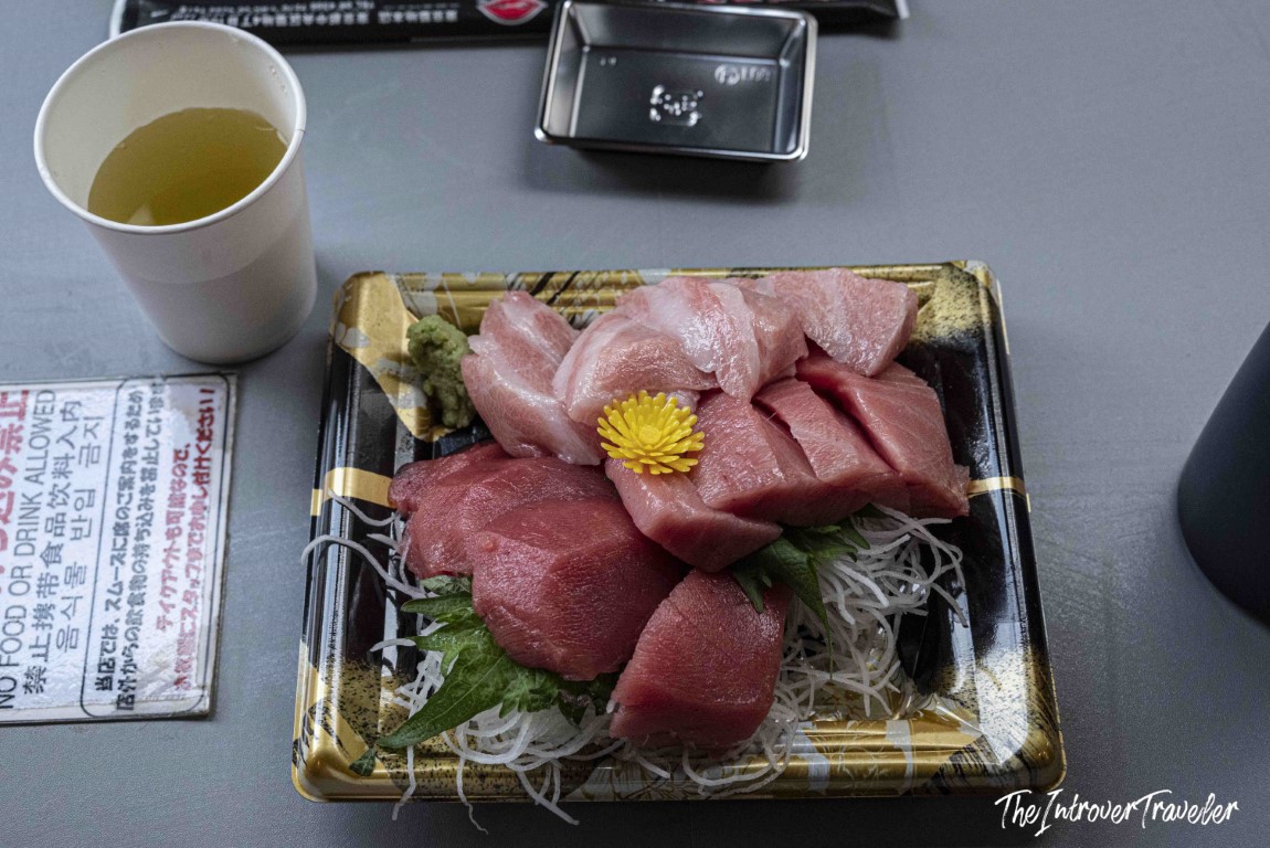 Fresh tuna sashimi platter with wasabi and green tea at Tsukiji outer market, Tokyo
