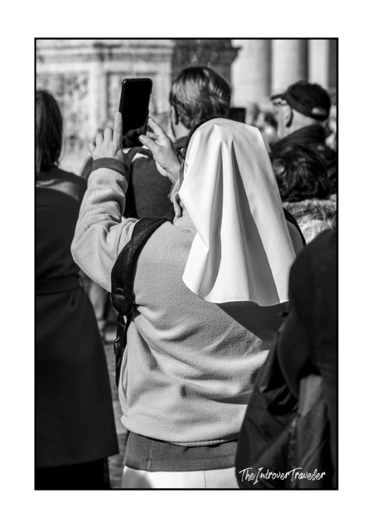 A nun photographing the Pope's Angelus address in St. Peter's Square, Vatican City