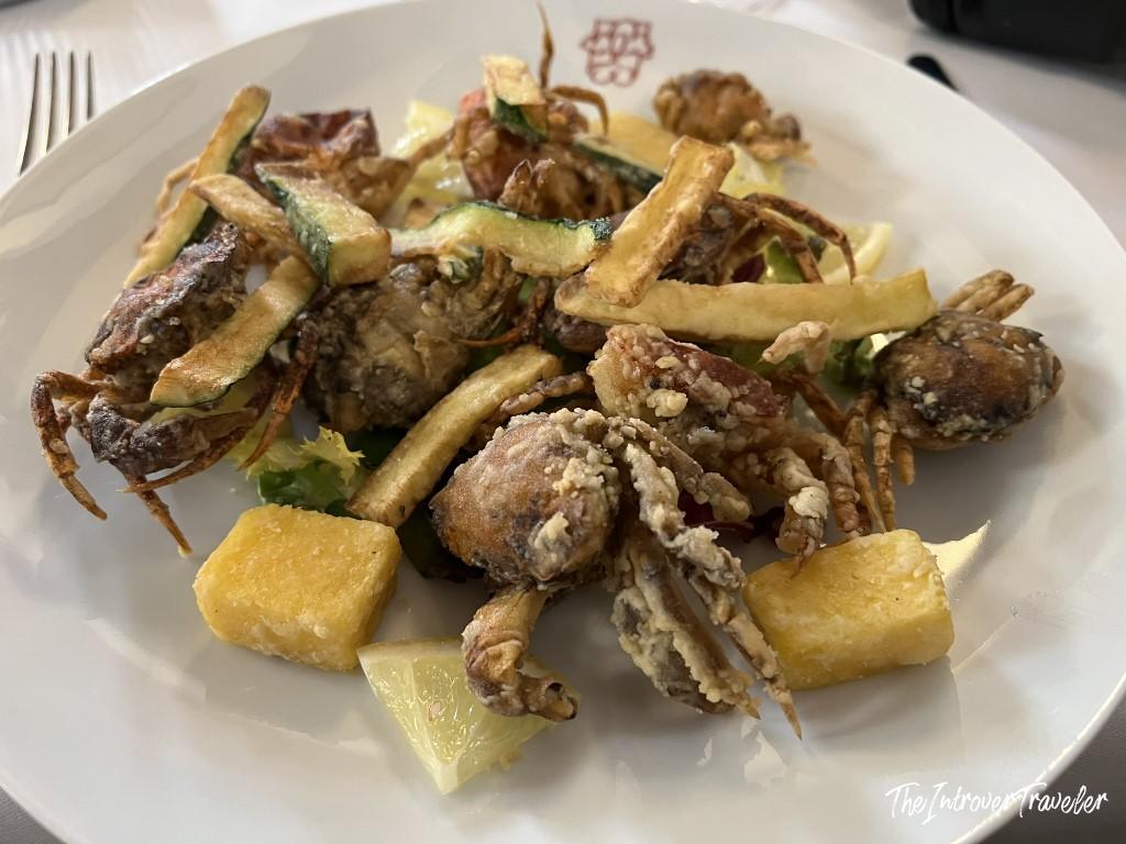 Plate of moeche fritte (fried soft-shell crabs) with zucchini and potatoes at Le Antiche Carampane, Venice