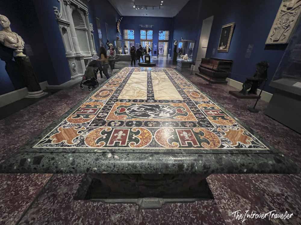 Ornate pietra dura table with Medici fleur-de-lis inlay in the Met Museum European galleries