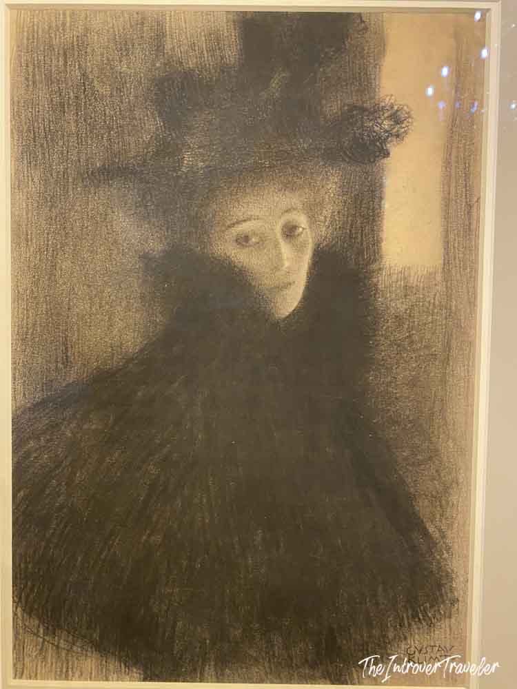 Charcoal drawing by Gustav Klimt of a woman in a feathered hat, displayed at the Albertina Museum Vienna