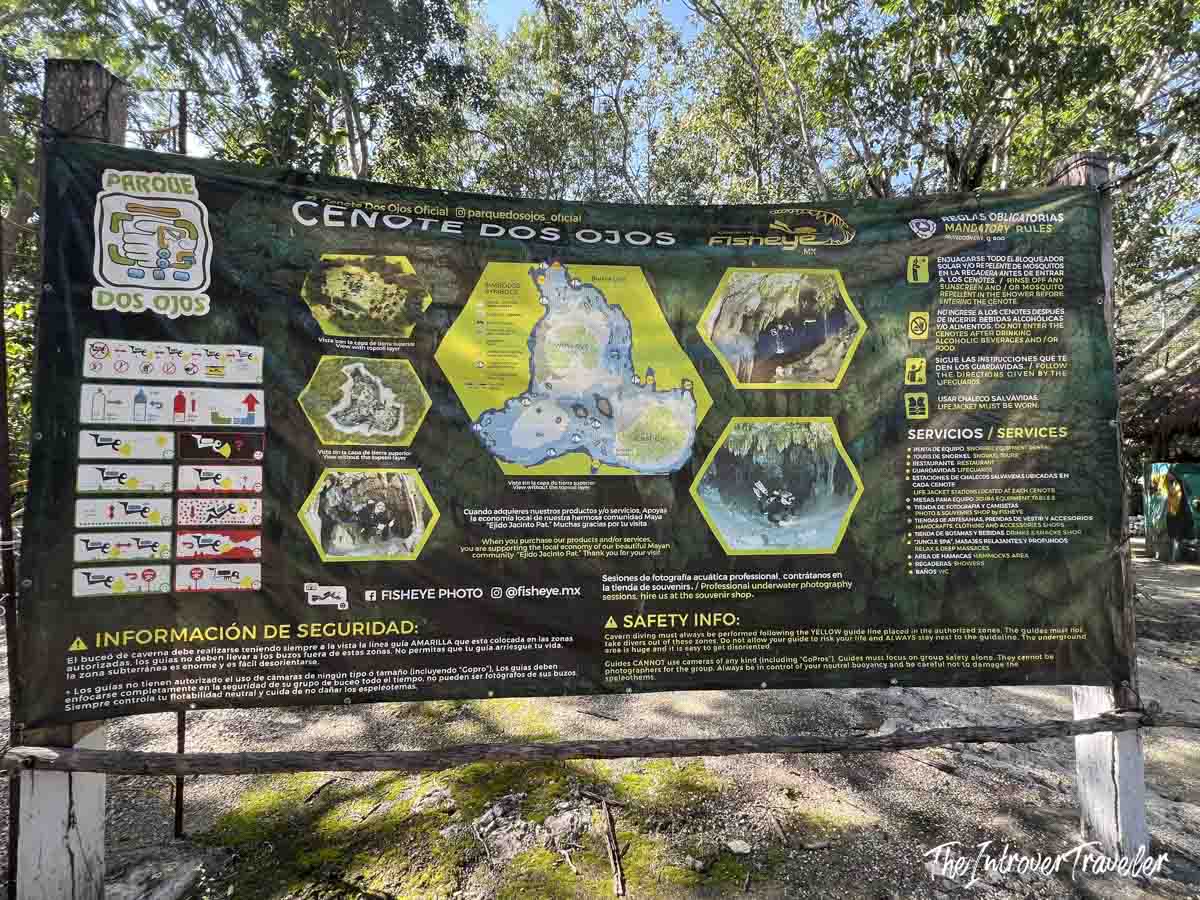 Cenote Dos Ojos official entrance sign with map, safety rules, and visitor guidelines in Mexico