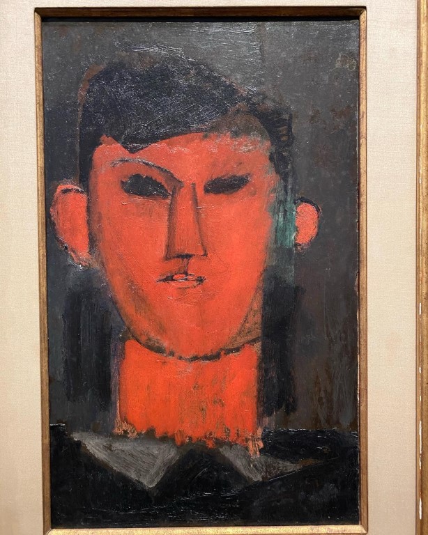 Portrait of Picasso by Modigliani, bold red face on dark background, at Albertina Museum Vienna
